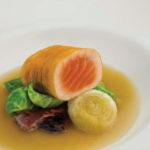 Recipe of the week: Potato-wrapped salmon with ham hock broth, cipollini onions, dried cherries and lovage