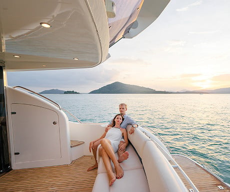 Couple relaxing on yacht