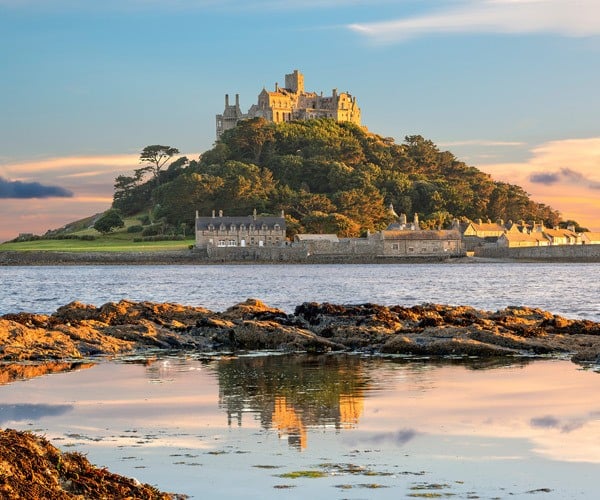 castle on hill in sea cornwall