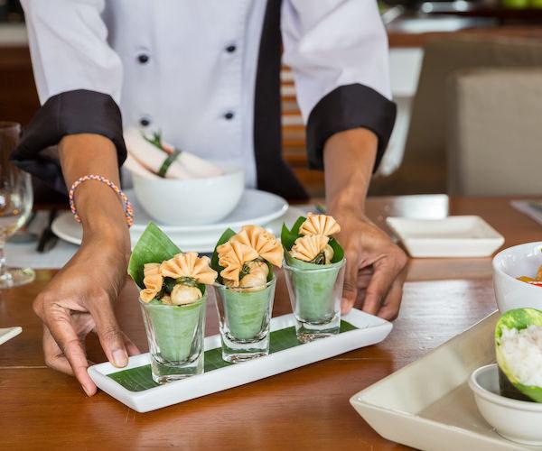 Chef preparing Thai cuisine at Baan Mika, a luxury 6 bedroom beach front villa located on Plai Laem Beach, Koh Samui, Thailand