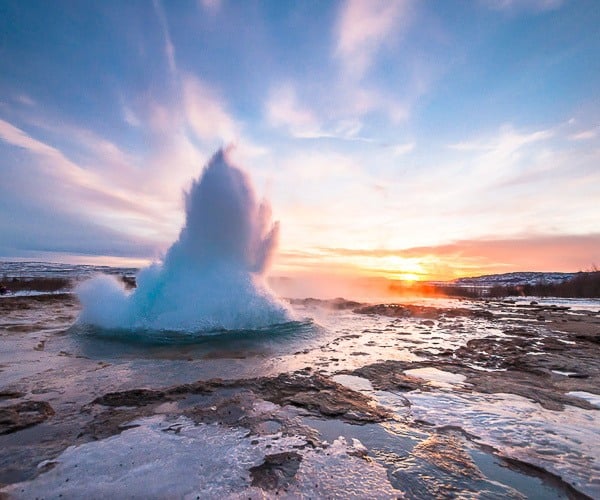 Eruption of Strokkur geyser on the popular Golden Circle Route in Iceland.