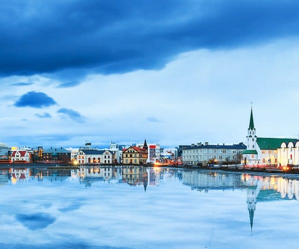 A serene view of the Tjornin lake in Reykjavik city center, Iceland