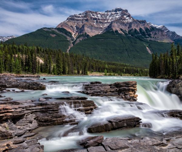 Waterfalls with a mountain in the background