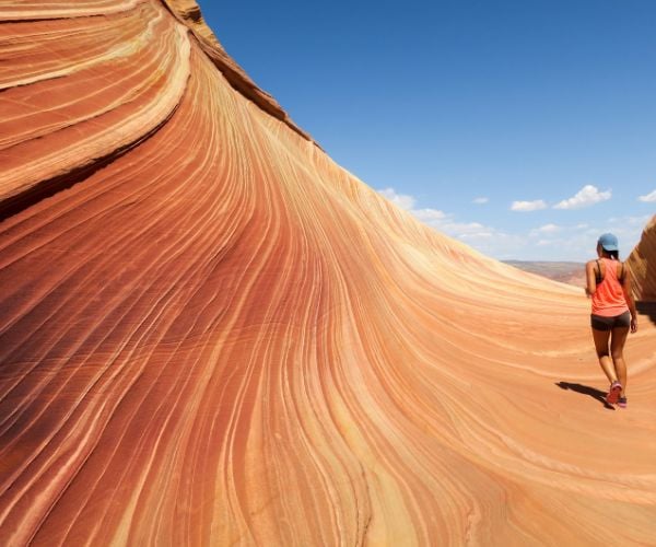 A woman walking on a sand structure at Bryce Canyon